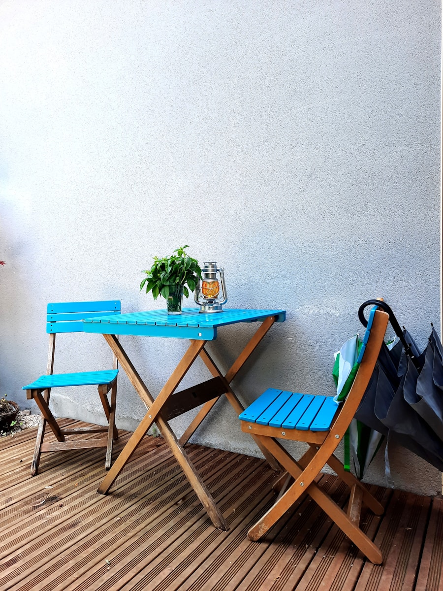 a table and two chairs on a deck